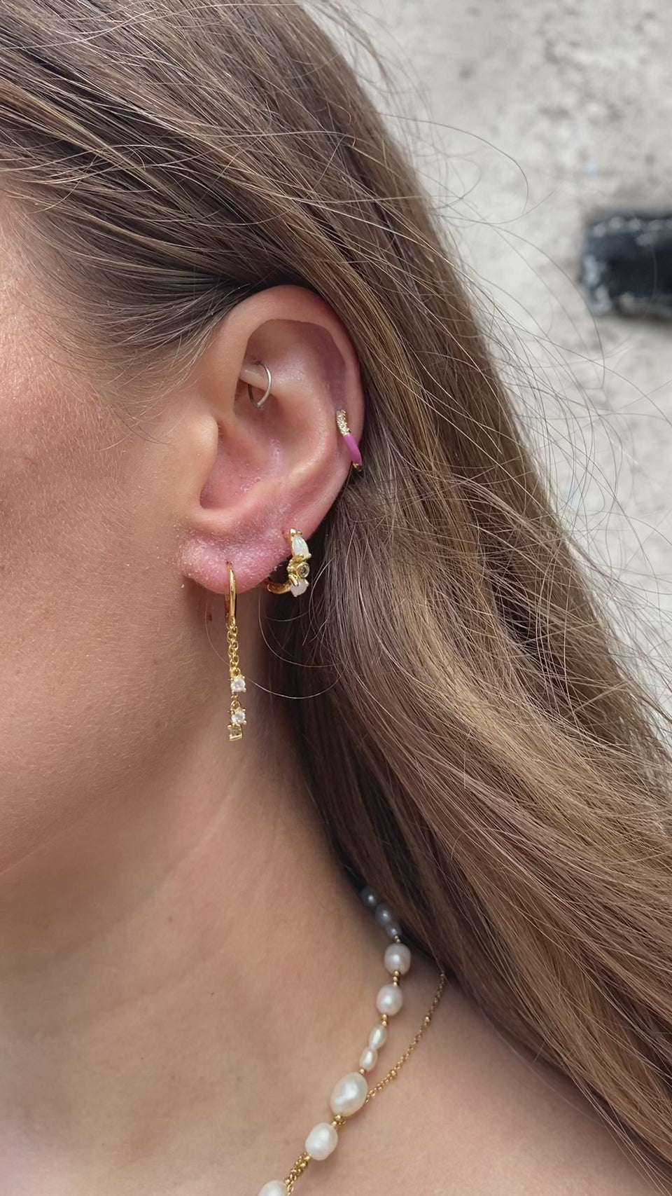 Dancing Queen Huggies, Reversible Earrings, Wave-shaped Silhouette, Enamel-coated Sterling Silver, Dazzling Crystals, Barbie Pink Earrings, Waterproof Earrings, Understated Elegance, Sparkle of the Sea, Sophisticated Jewelry, Occasion Accessories, Dance-inspired Jewelry, Luxurious Enamel, Versatile Earrings, Crystal Embellishments