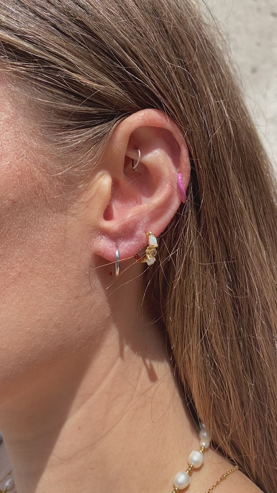 Two-Tone Huggie Hoops, Reversible Earrings, Gold and Silver Earrings, Versatile Jewelry, 925 Silver and Gold Plating, Dual-Tone Design, Two Looks in One, Convenient Wear, Secure Huggie Hoop Shape, 10mm Diameter Earrings, Hypoallergenic Jewelry